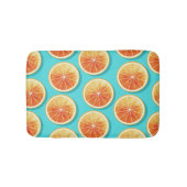 Orangefarbene Scheiben auf blau Badematte (Vorderseite)