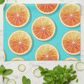 Orangefarbene Scheiben auf blau Geschirrtuch (Gefaltet)