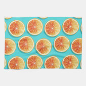 Orangefarbene Scheiben auf blau Geschirrtuch (Horizontal)