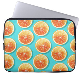 Orangefarbene Scheiben auf blau Laptopschutzhülle