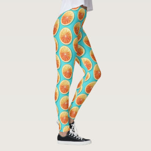 Orangefarbene Scheiben auf blau Leggings