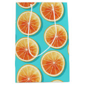 Orangefarbene Scheiben auf blau Mittlere Geschenktüte (Vorderseite)