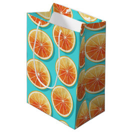 Orangefarbene Scheiben auf blau Mittlere Geschenktüte