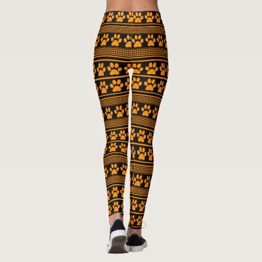 Orangefarbene schwarze Pfotenmuster-Leggings Leggings (Rückseite)