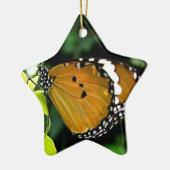 Orangefarbene, schwarze und weiße Schmetterlinge a Keramikornament (Links)