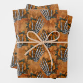 Orangefarbene Skeletthandschuhe auf Orange Geschenkpapier Set (Beispiel)
