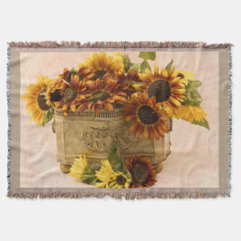 Orangefarbene Sonnenblumen im Körbchen Decke