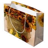 Orangefarbene Sonnenblumen im Körbchen Große Geschenktüte (Rückseite Schrägansicht)