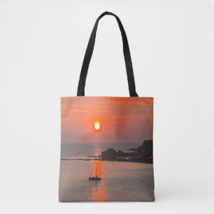 Orangefarbene Sonnenuntergänge über dem Meer Tasche