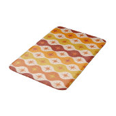 Orangefarbene Sternexplosionen aus der Mitte des J Badematte (Schrägansicht)