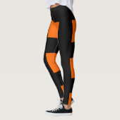 Orangefarbene Streifen Leggings (Links)
