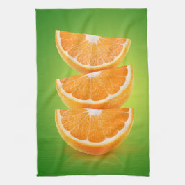 Orangefarbene Stücke auf grün Geschirrtuch
