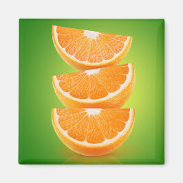 Orangefarbene Stücke auf grün Magnet