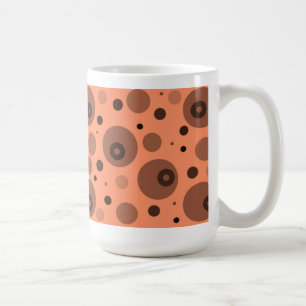 orangefarbene und braune Kreise und Punkte Kaffeetasse