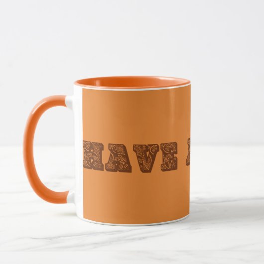 Orangefarbene und braune Tasse "Have a cuppa" (Links)