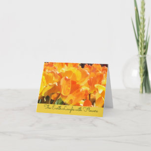 Orangefarbene und gelbe Tulips Erde lacht mit Blum
