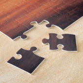 Orangefarbene und Lila Sonnenuntergangswolken über Puzzle (Seite)