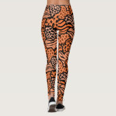 Orangefarbene und schwarze gürtelartige Prinzessin Leggings (Rückseite)