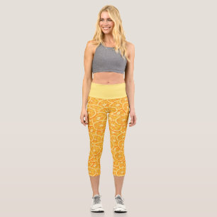 Orangefarbene Wasserscheiben Capri Leggings
