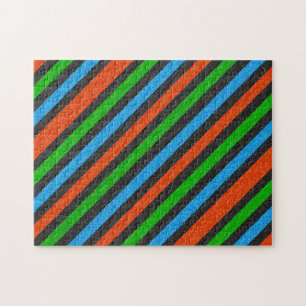 Orangefarbener, blauer, grüner, schwarzer Glitzer Puzzle