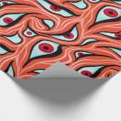 Orangefarbener Horror mit bösen Augen, dunkelrot Geschenkpapier (Ecke)