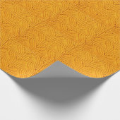 Orangefarbener Pullover, texturierter Hintergrund. Geschenkpapier (Ecke)