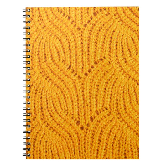 Orangefarbener Pullover, texturierter Hintergrund. Notizblock (Vorderseite)