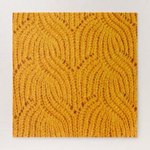 Orangefarbener Pullover, texturierter Hintergrund. Puzzle