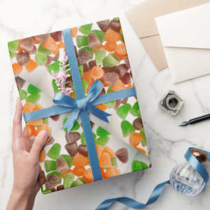 Orangefarbener Rotgummi Bonbons, bestreut Geschenkpapier