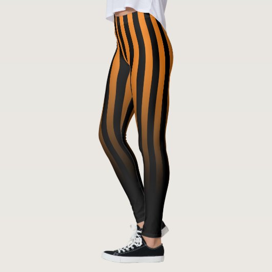 Orangefarbener schwarzer Streifen wird bis schwarz Leggings (Links)