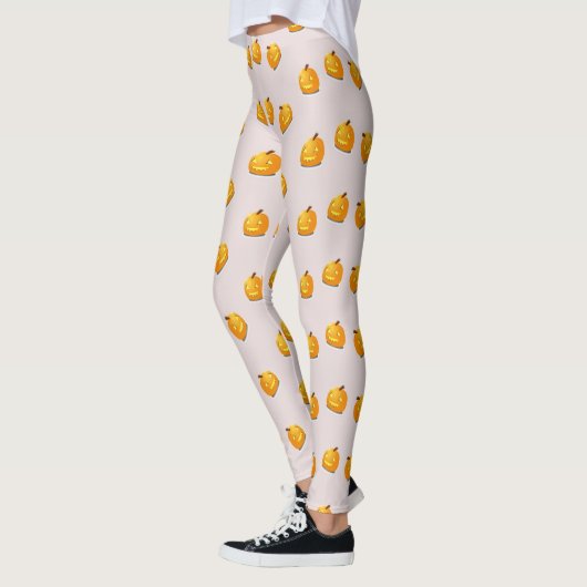 Orangefarbenes Kürbiskopfmuster Leggings (Links)