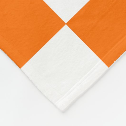 Orangefarbenes Muster eines Karos Fleecedecke (Ecke)