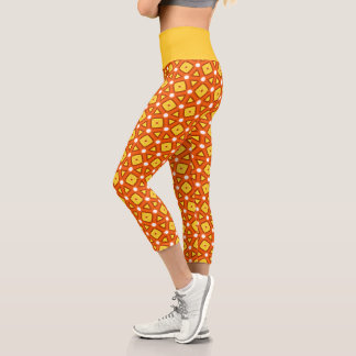 Orangefarbenes Quadrat- und Dreiecksgeflecht-naive Capri Leggings