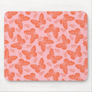 Orangefarbenes Schmetterlingsmuster im rosa Hinter Mousepad