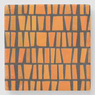 Orangefarbenes und schwarzes afrikanisches Stammes Steinuntersetzer