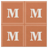 Orangemonogramm Stoff (Nahaufnahme)