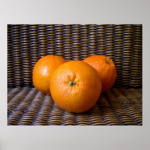 Orangen in einer Korbkomposition Poster