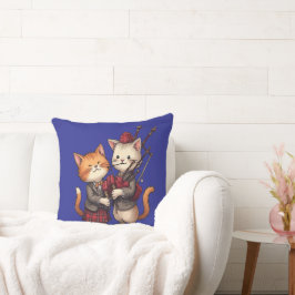 Orangene Katzen spielen Dudelsack und tragen Tarta Kissen