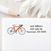 Orangenfahrrad auf weißem Etikett (Insitu)