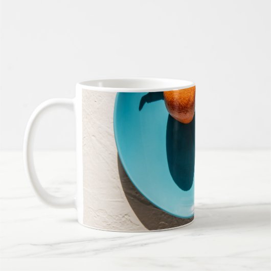 Orangenfrüchte auf Platte Kaffeetasse (Links)