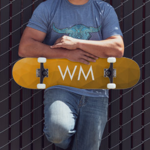 Oranger geometrischer Maschenmuster-Monogramm Skateboard