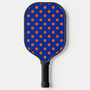 Oranges Musterdesign auf blauem Hintergrund mit Pu Pickleball Schläger