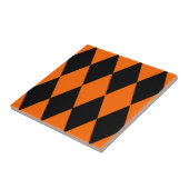 Oranges Schwarzes Harlekin-Diamant-Schachbrettmust Fliese (Seite)