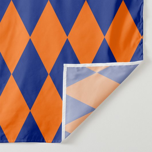 Oranges und blaues Harlekin-Karuomuster Design Stoff