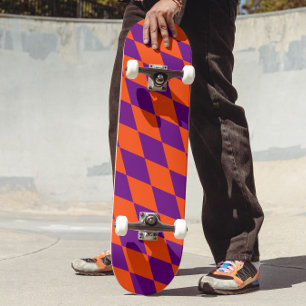 Oranges und violettes Harlekin-Karuomuster Design Skateboard