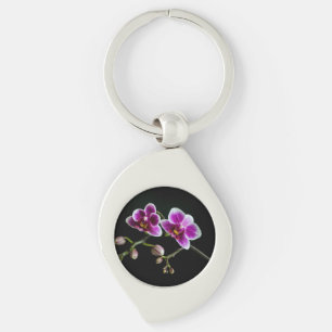 Orchid pinkfarbene weiße Farbe auf schwarz blass s Schlüsselanhänger