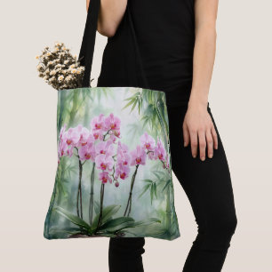 Orchideenpflanze in Rosa auf Bambushintergrund Tasche