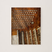 Organist - bereiten Sie an den Kontrollen vor Puzzle (Vertikal)