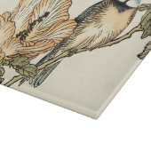 Orientalischer Vogel gehockt auf Niederlassung Schneidebrett (Ecke)