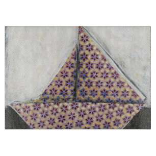 Origami Segelboot auf Stern-Entwurfs-Papier Schneidebrett